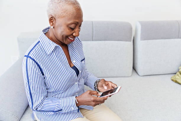 istock Tech Savvy Senior Woman Using a Smartphone 1184028546