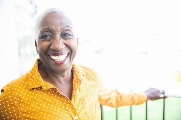 istock Woman Relaxing on Her Balcony 1184031072