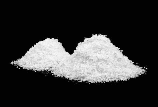 istock Pile of white snow on a black background 1184032155