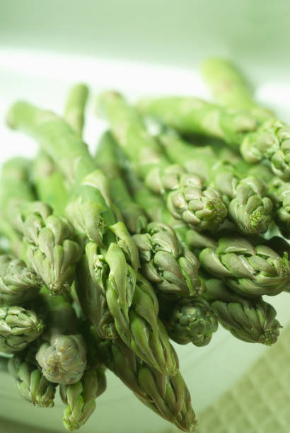 istock Close up of raw asparagus 1184032227