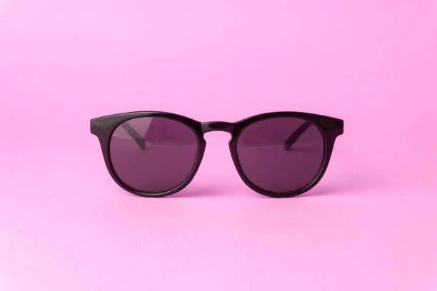 istock Pink vintage sunglasses on a pure pink background 1184032379