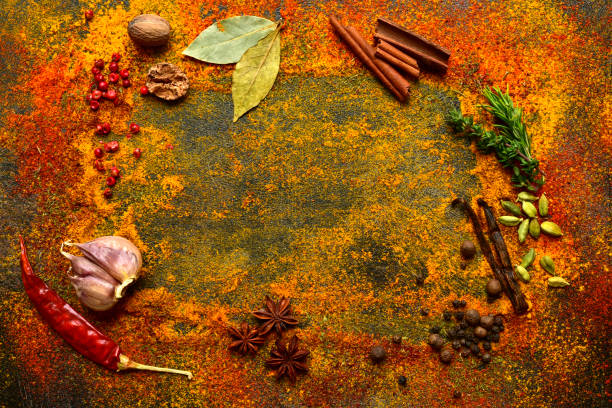 istock Culinary background with variety of spices on a dark table. 1184032465