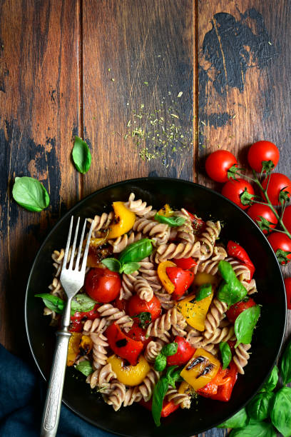 istock Whole wheat fusilli pasta with grilled vegetables 1184033306