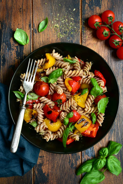 istock Whole wheat fusilli pasta with grilled vegetables 1184033359
