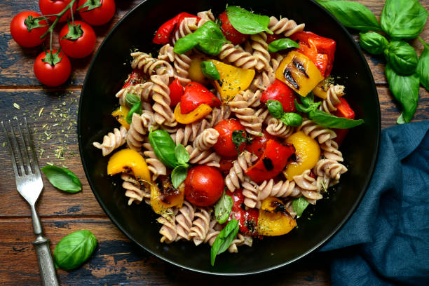 istock Whole wheat fusilli pasta with grilled vegetables 1184033377