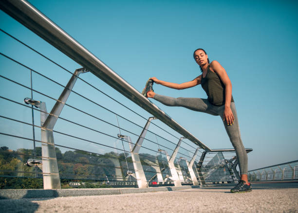 istock Calm athlete warming up before running stock photo 1184034824
