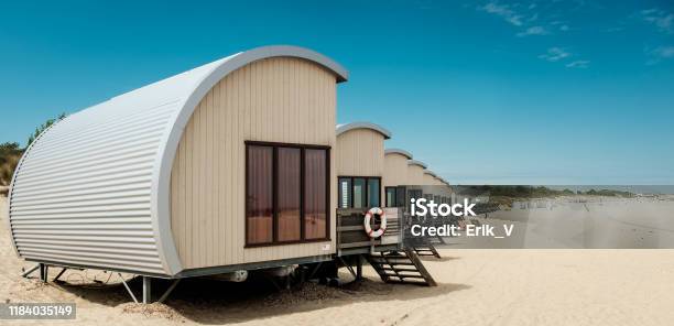 Row Of Holiday Houses On The Beach Of Zeeland Stock Photo - Download Image Now - Netherlands, Beach, Beach House