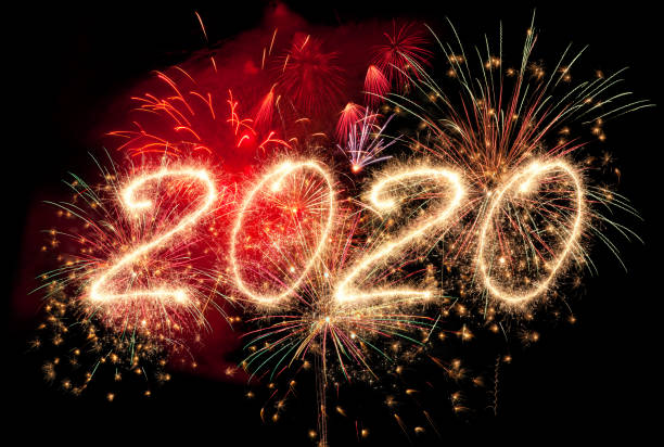 istock New year fireworks and 2020 written in sparkling letters 1184035288