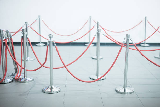 istock Mobile fence barrier with red belt 1184036384