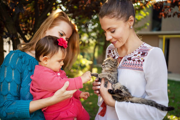 istock Family with cat at back yard 1184037429