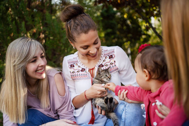 istock Family with cat at back yard 1184037463