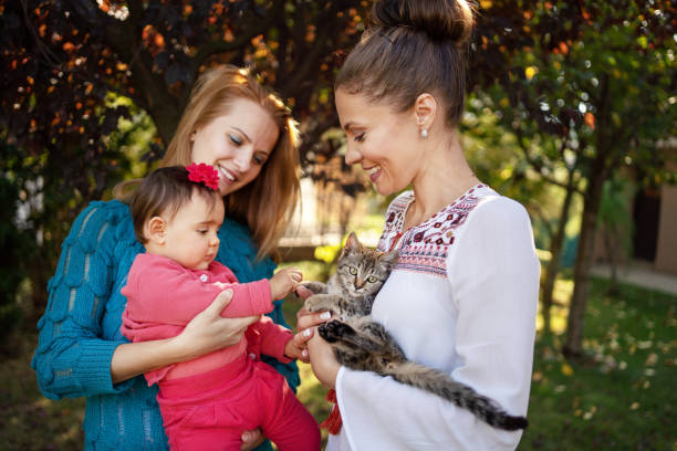 istock Family with cat at back yard 1184037495