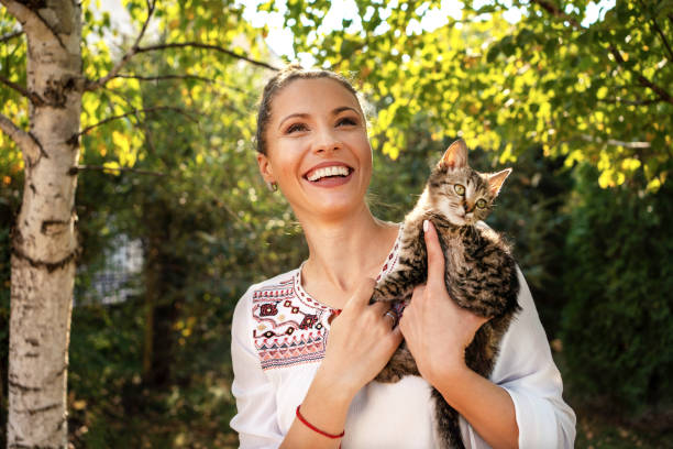 istock Woman with cat at back yard 1184037542