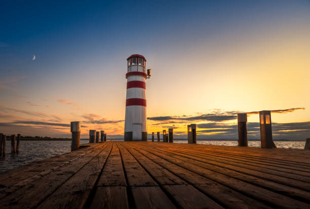 istock Beautiful Lighthouse in Austria Podersdorf am see during sunset. 1184038053