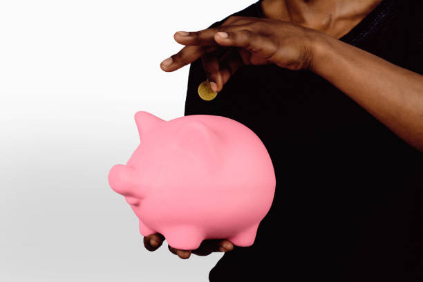 istock Young man with piggy bank 1184039537