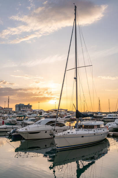 istock Yellow sunset in the sea harbor with moored yachts. 1184040732
