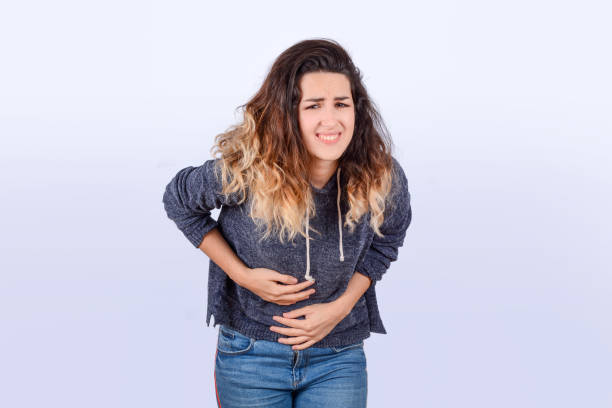 istock Young woman is having stomach ache. 1184041641