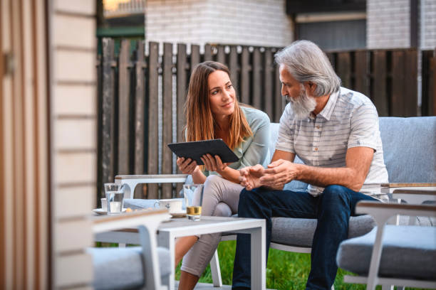 istock Father and his Daughter using Digital Tablet on the Terrace 1184041671