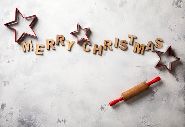 Merry Christmas.Baking Background. Lettering in wooden letters .Holiday concept.Flat lay, top view,Copy space .
