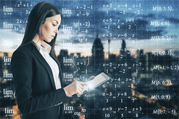 istock Businesswoman looking at formulas 1184051000