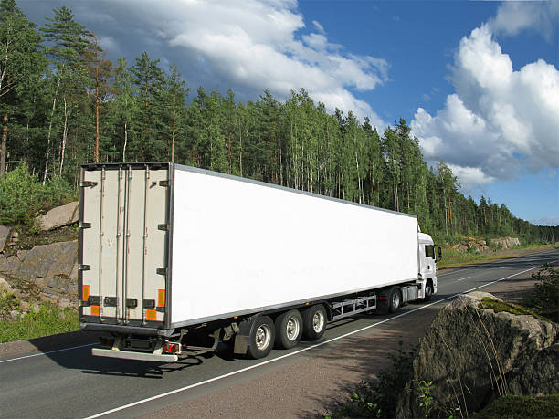 istock white truck on rural highway 118405154