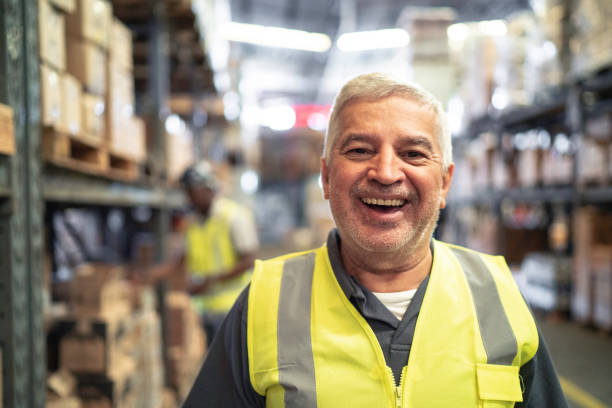istock Worker senior man portrait at warehouse 1184055256