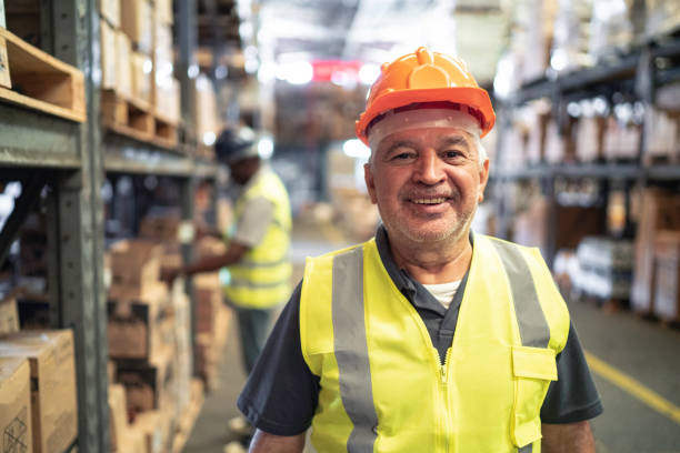 istock African worker senior man portrait at warehouse 1184055363