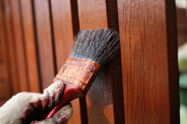 istock painting the fence 1184057213