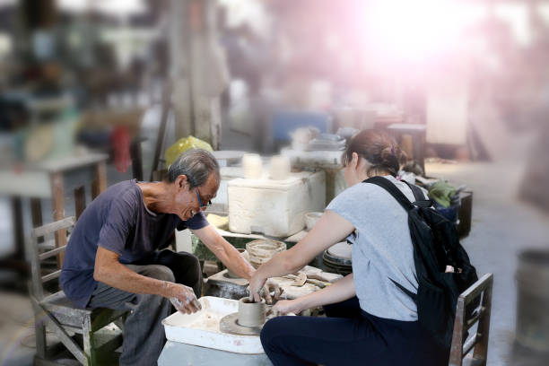 istock Ceramic Pottery Wheel Throwing in Traditional Pottery Factory 1184057590