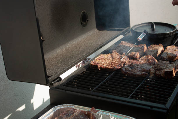 istock Cooking meat on the grill using gourmet specialty tools with thermometer Celsius degrees 1184057907