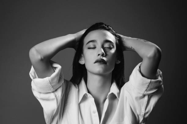 istock Beautiful female with closed eyes 1184061044