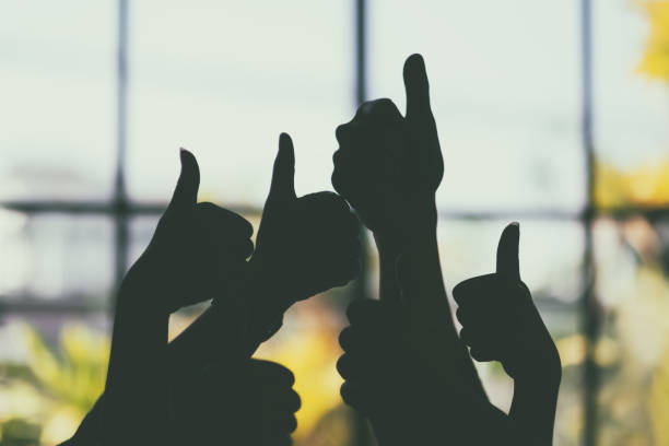 istock many people's hands making thumb up sign 1184080564
