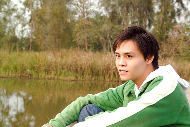 Portrait of a young man in the nature stock photo