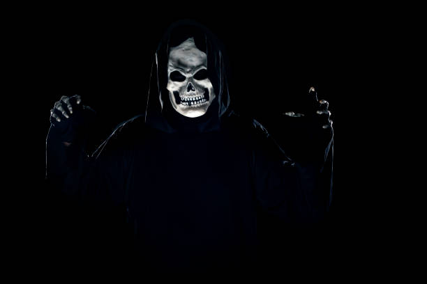 istock Grim Reaper Ghost Coming Out of the Dark Shadows 1184090485