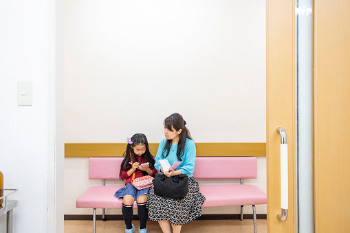 Mother and Daughter in a Hospital Waiting Room