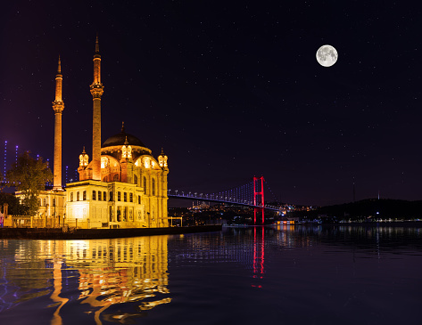 Ortakoy Mosque at night, moonlight view in Istanbul, Turkey.