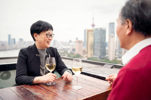 istock Affluent senior couple enjoying wine at a rooftop bar 1184102721
