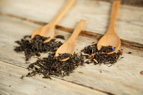 istock different varieties of natural tea on a bamboo spoon on a wooden background 1184102748