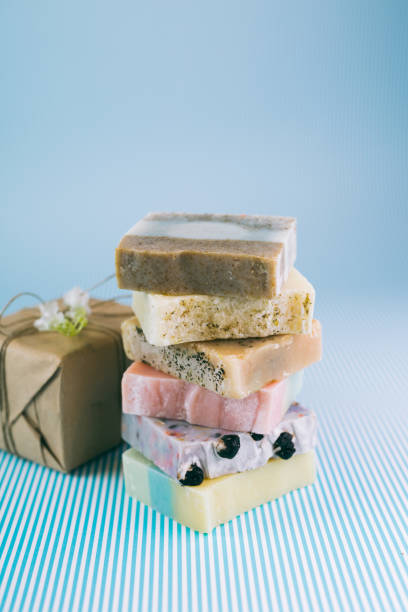 istock colorful handmade soaps on blue background 1184112130