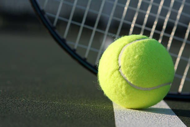 istock Tennis Ball with Racket Behind 118411215