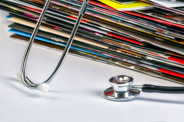 istock Magaziness and stethoscope. 1184113277