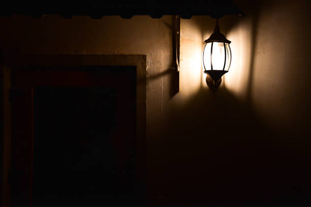 istock Old night lamp on the wall of a house 1184113372
