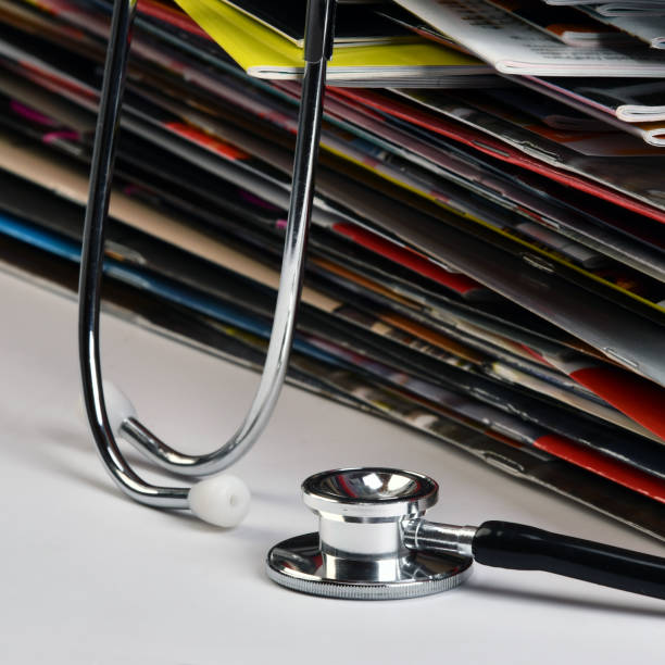 istock Magaziness and stethoscope. 1184113458