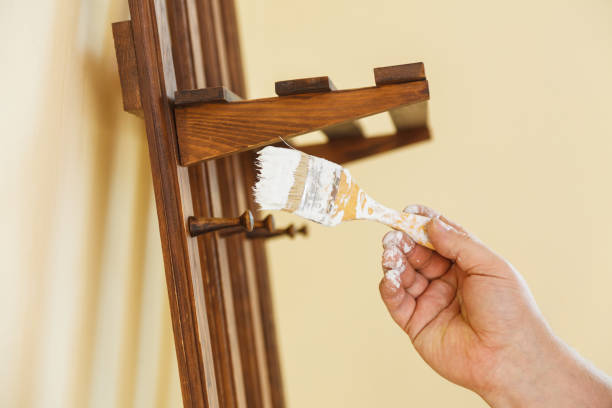 istock Person renovating wooden hanger 1184115730