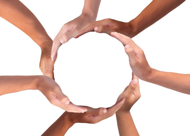 istock Conceptual symbol of multiracial human hands making a circle on white background with a copy space in the middle 1184117161