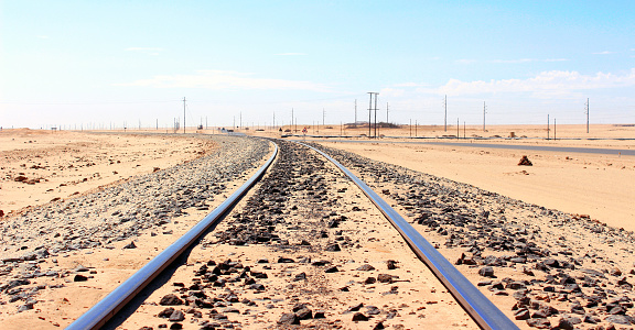 Barstow, California, United States - August 31, 2023: Tracks and sign of train station in Barstow, California