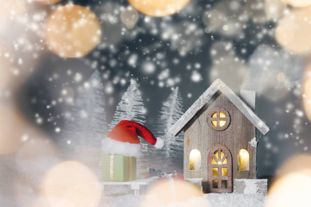 istock Christmas card with house in snow 1184120777