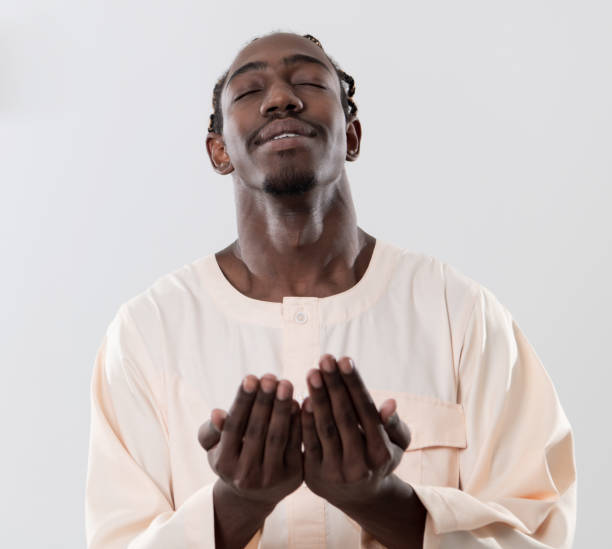 istock african man pray to Allah 1184123447
