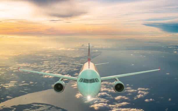 istock Airplane in the sky at sunrise ,Flying above the clouds. 1184123636
