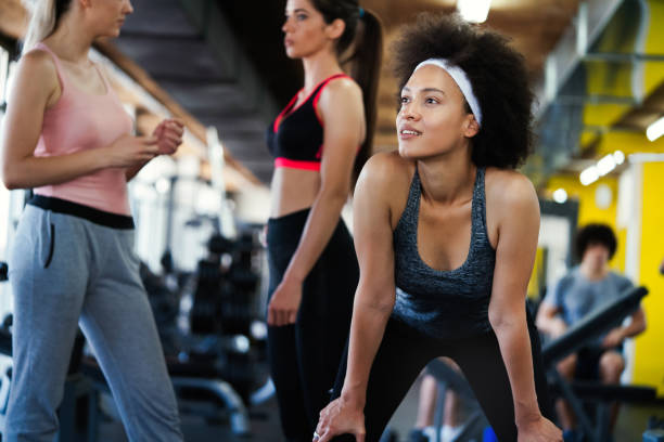 istock Group of fit people at the gym exercising 1184123655